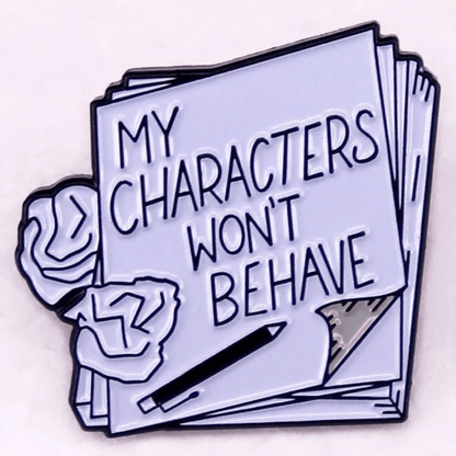 A cartoon-style image of stacked papers with MY CHARACTERS WON’T BEHAVE, a pencil, eraser, and paper balls by Kiss Me Later—ideal for enamel pins or book lover badge designs.