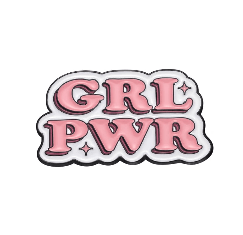 Enamel pin features pink bubble letters spelling GRL PWR on a white background with a black outline and star accents—an empowering accessory for fans of bold feminist pins.
