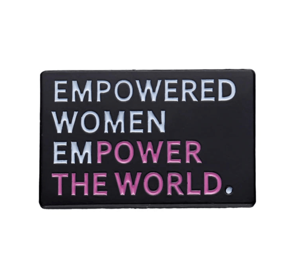 Black rectangular enamel pin features EMPOWERED WOMEN EMPOWER THE WORLD—with EMPOWERED, WOMEN, and THE WORLD in white and POWER in pink. An inspiring piece for any feminist pin collection.