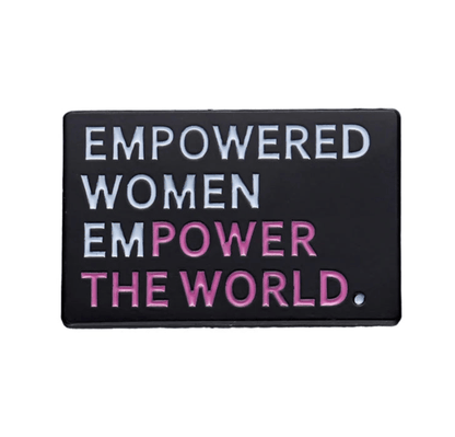 Black rectangular enamel pin features EMPOWERED WOMEN EMPOWER THE WORLD—with EMPOWERED, WOMEN, and THE WORLD in white and POWER in pink. An inspiring piece for any feminist pin collection.