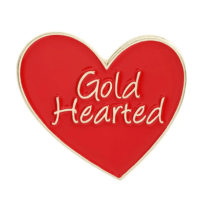 Enamel pin features a red and gold heart shape with a gold outline and the words Gold Hearted beautifully written in gold at the center.