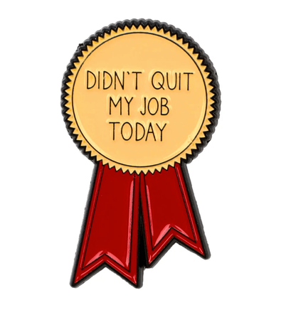 gold medal features jagged edges, red ribbons, and the text DIDNT QUIT MY JOB TODAY in bold caps on the front, accented with a tiny red love heart enamel pin for added charm.