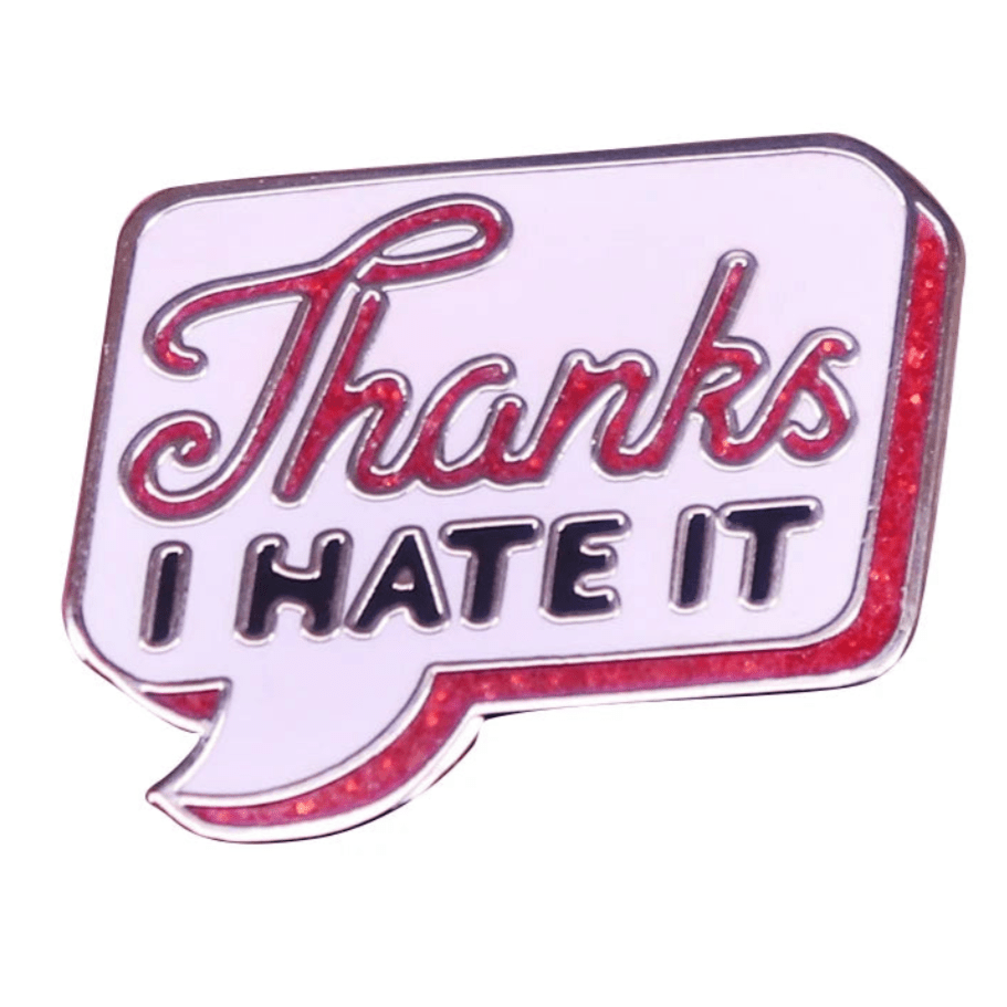 Retro speech bubble glitter enamel pin features Thanks I HATE IT in bold red and black on white with a red border. Ships worldwide.