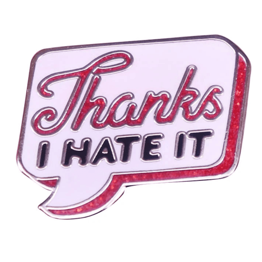 Retro speech bubble glitter enamel pin features Thanks I HATE IT in bold red and black on white with a red border. Ships worldwide.