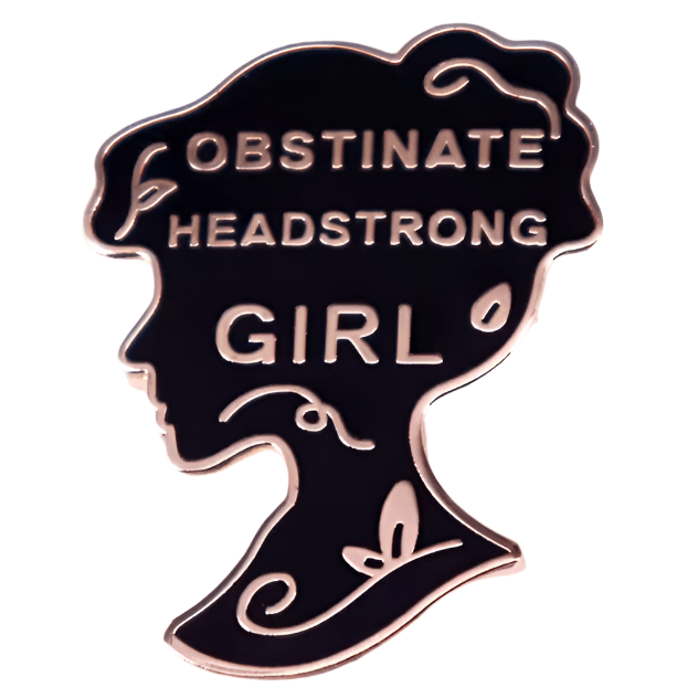 Black enamel pin, shaped like a woman’s profile with “OBSTINATE HEADSTRONG GIRL” and floral designs, creates a bold oval badge perfect for any collection.