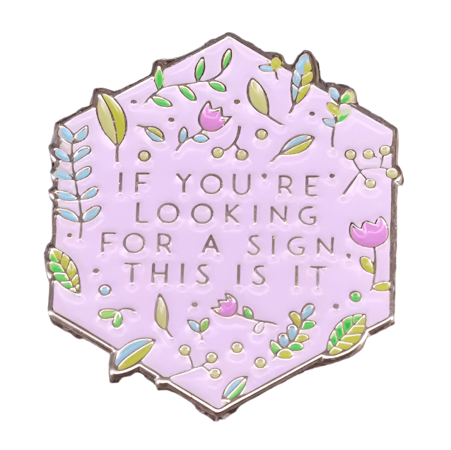 The My Cutesy Era hexagonal enamel pin features a pastel purple background with green leaves and pink flowers, plus the text IF YOURE LOOKING FOR A SIGN, THIS IS IT—a perfect addition to your Black Sheep Club collection.