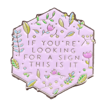 The My Cutesy Era hexagonal enamel pin features a pastel purple background with green leaves and pink flowers, plus the text IF YOURE LOOKING FOR A SIGN, THIS IS IT—a perfect addition to your Black Sheep Club collection.
