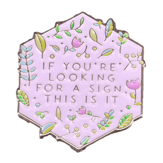 The My Cutesy Era hexagonal enamel pin features a pastel purple background with green leaves and pink flowers, plus the text IF YOURE LOOKING FOR A SIGN, THIS IS IT—a perfect addition to your Black Sheep Club collection.