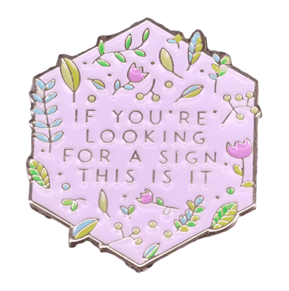 A charming hexagonal lilac enamel pin by My Cutesy Era, decorated with flowers and leaves, features the text: IF YOU’RE LOOKING FOR A SIGN, THIS IS IT—perfect for any Black Sheep Club member.