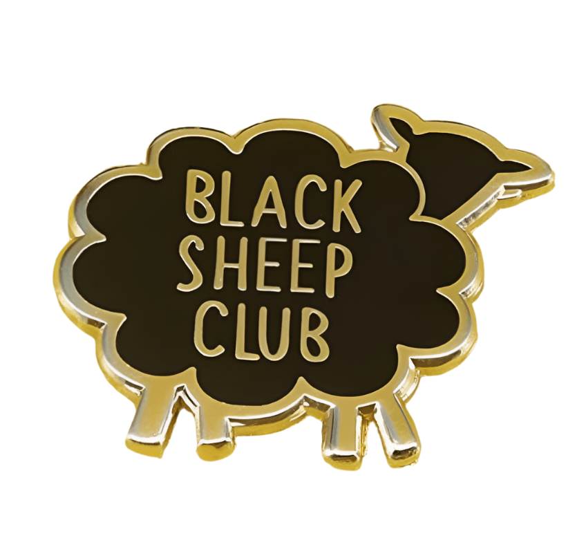 My Cutesy Era black and gold enamel pin features a sheep design with gold edges and BLACK SHEEP CLUB written in gold on its body.