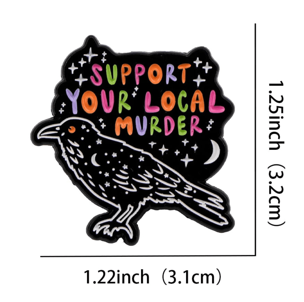 Add a touch of whimsy with a colorful enamel pin: a black crow with stars and Support Your Local Murder in multicolored letters. Measures 1.25 tall by 1.22 wide—a striking piece for any cat pin or coffin badge collection!.