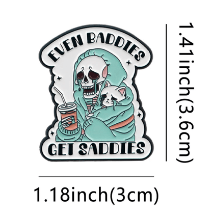 Show off your love for true crime with this cat pin featuring a skeleton in a green hoodie holding a drink and a sad white cat, plus the text EVEN BADDIES GET SADDIES. Measures 1.41 tall x 1.18 wide.