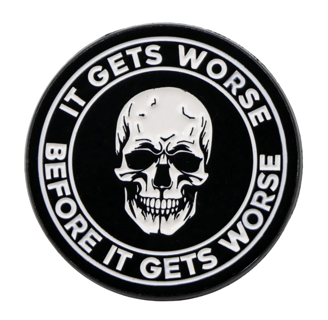 A black circular emo pin by Kiss Me Later featuring a white skull at the center. Bold white text around it reads: IT GETS WORSE BEFORE IT GETS WORSE—perfect for skeleton pin fans.