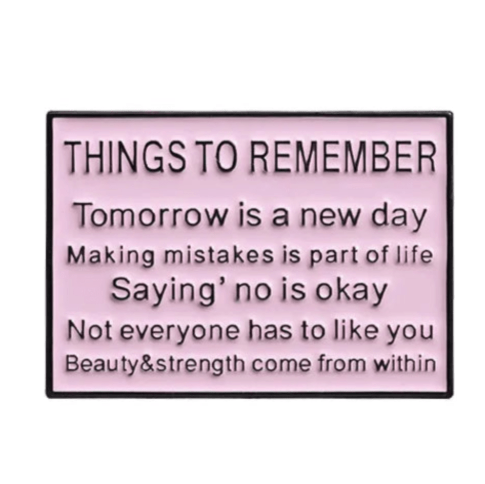 A pink Kiss Me Later sign titled Things to Remember features motivational reminders about new beginnings, mistakes, saying no, self-acceptance, and inner beauty—perfect inspiration for a limited edition motivational pin.