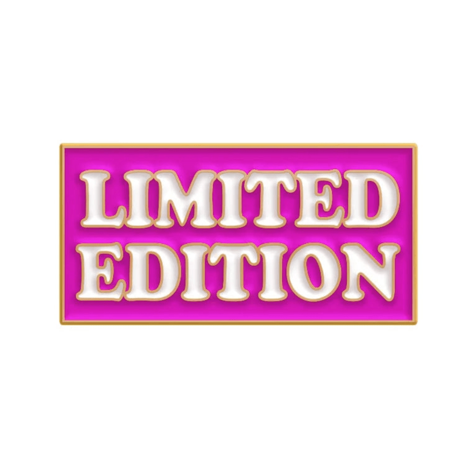 A rectangular sign from Kiss Me Later features a bright pink background, gold border, and bold white 3D LIMITED EDITION text—ideal inspiration for a motivational or exclusive enamel pin release.