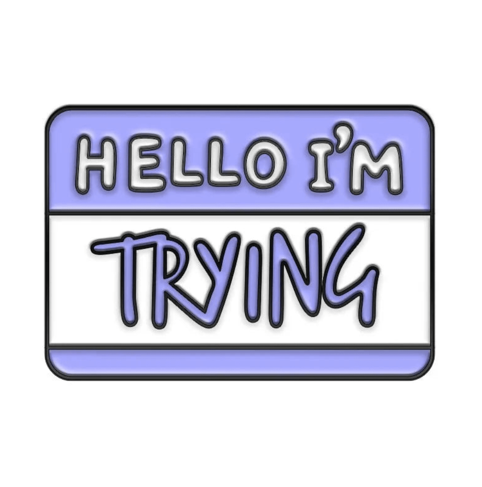 A blue and white name tag badge features HELLO IM in block letters and TRYING in large, handwritten-style script.