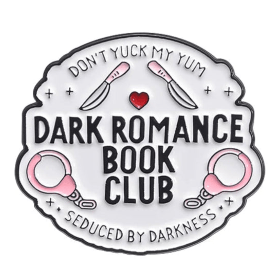 My Cutesy Era enamel pin with Dont Yuck My Yum, riding crops, a red heart, pink handcuffs, Seduced by Darkness, and Dark Romance Book Club on white—perfect for dark romance or True Crime fans.