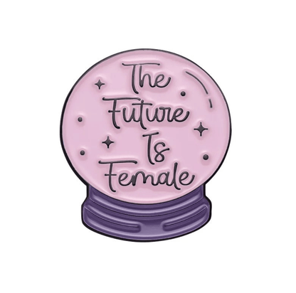 A pink crystal ball by My Cutesy Era with The Future Is Female in cursive, resting on a purple star-accented base—perfect for displaying beside your motivational or body positive enamel pin collection.