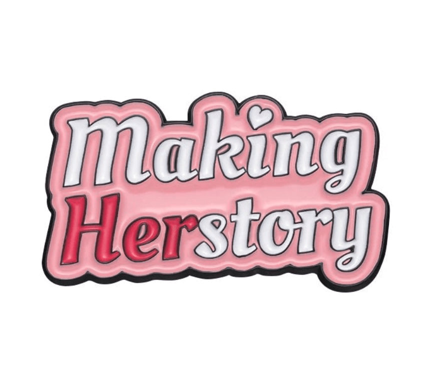My Cutesy Era’s motivational enamel pin features Making Herstory in pink and red, with Her highlighted in red and a heart over the “i”—a perfect, body-positive accessory for daily inspiration.