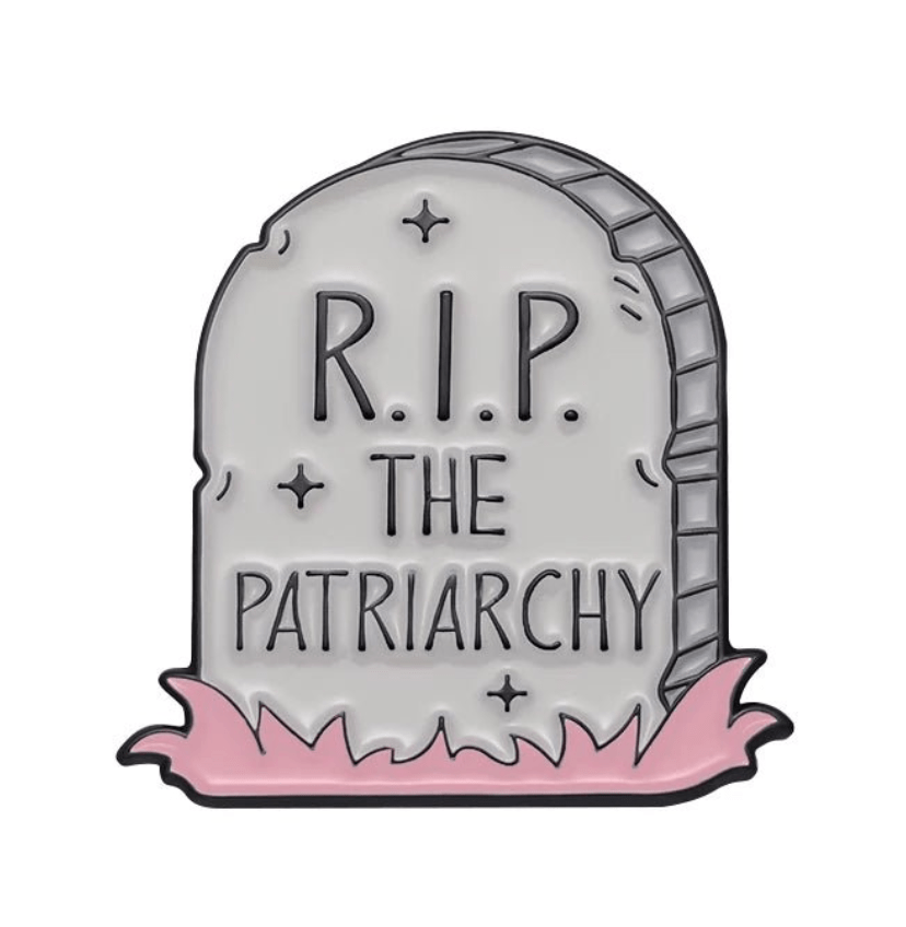 My Cutesy Era’s illustrated gravestone pin features R.I.P. THE PATRIARCHY and pink grass-like details, channeling empowering vibes—because well-behaved women rarely make history.