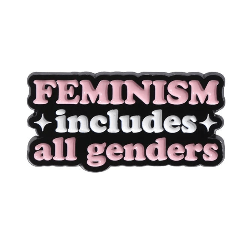 The My Cutesy Era pink measuring pin features FEMINISM includes all genders in pink and white on black with two sparkles—a stylish, inspirational quote pin celebrating inclusivity.