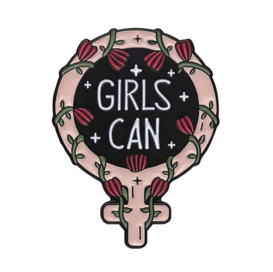 My Cutesy Era’s enamel pin, shaped like a feminist symbol and adorned with red flowers, green vines, and “GIRLS CAN” in white, radiates empowerment and positivity.