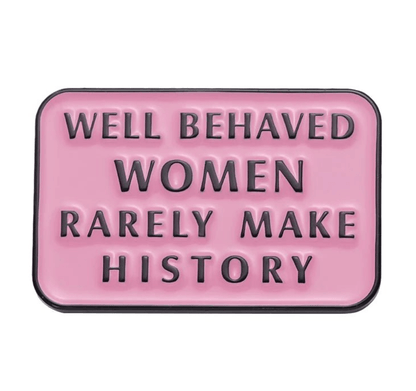 My Cutesy Era’s pink rectangular enamel pin features bold black text: “Well behaved women rarely make history”—a motivational accessory designed to inspire confidence and spark conversation.