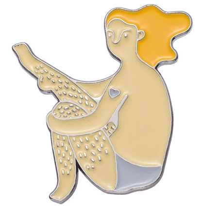 My Cutesy Era body positive enamel pin features a confident figure with long orange hair, visible leg hair, and a heart on their arm, sitting in underwear—a motivational accessory celebrating self-love and individuality.