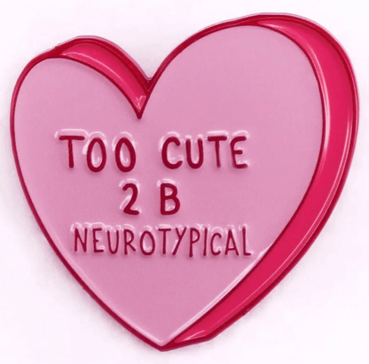 From My Cutesy Era, this pink heart enamel pin features raised TOO CUTE 2 B NEUROTYPICAL text, a red outline, and a light pink center—making it a quirky addition to any collection.