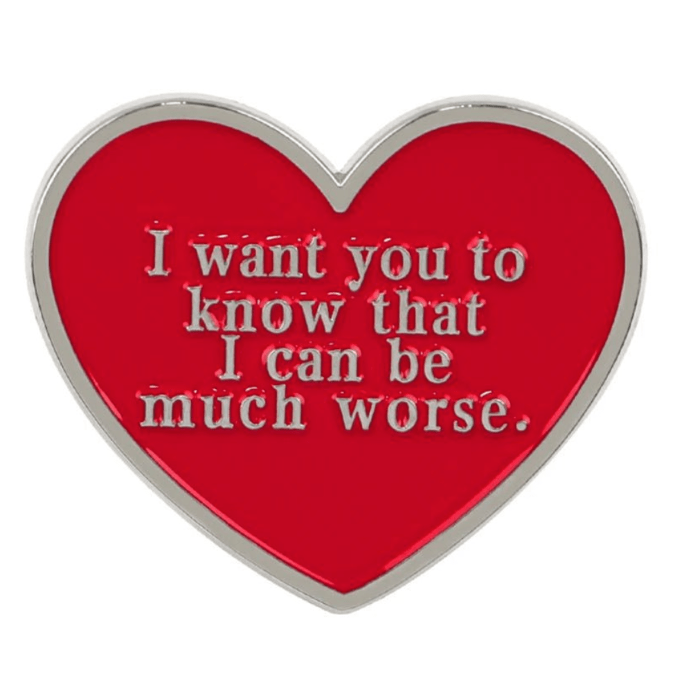The My Cutesy Era red heart-shaped enamel pin features silver edges and raised silver text: "I want you to know that I can be much worse." It's the perfect Delulu accessory for your collection.