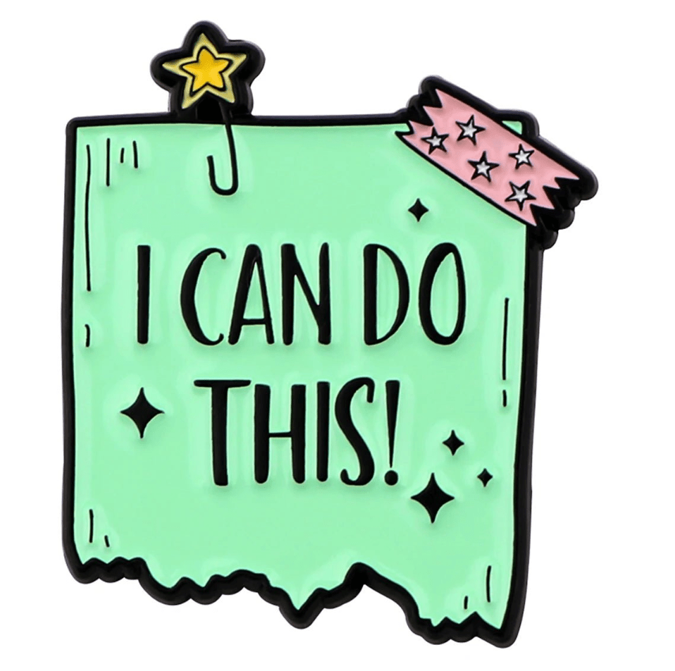 A mint green note from My Cutesy Era with jagged edges reads I CAN DO THIS! in bold black letters, serving as a motivational reminder. Its decorated with a yellow star clip and pink, star-patterned tape in the top corners.