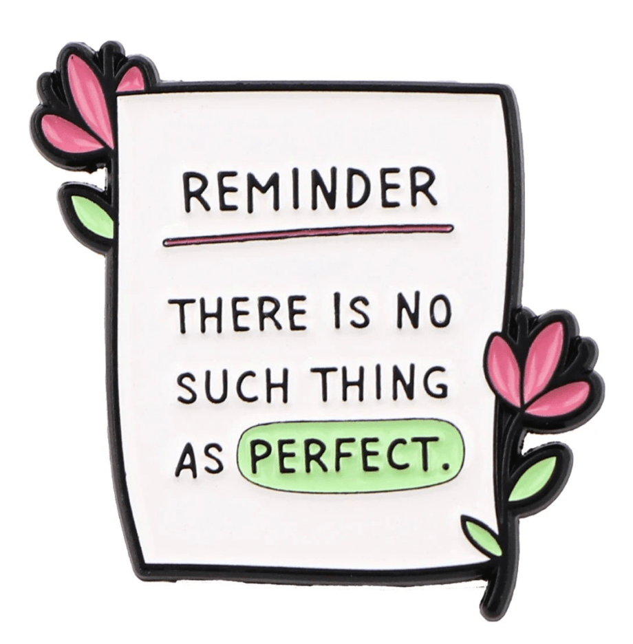 A My Cutesy Era pin shaped like a paper note with pink flowers, featuring REMINDER — THERE IS NO SUCH THING AS PERFECT and the word PERFECT highlighted green—a gentle mental health reminder.