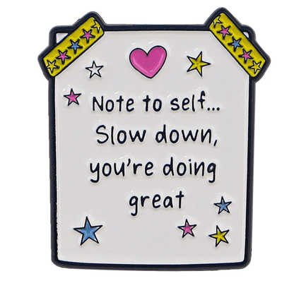 A My Cutesy Era white pin with stars, a pink heart, and yellow tape at the top corners. It features the text: Note to self... Slow down, you’re doing great—a motivational mental health reminder.
