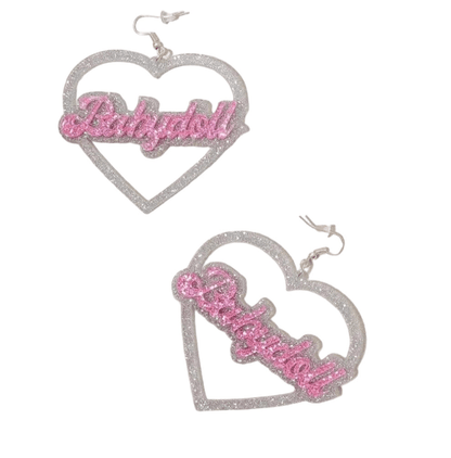 Add sparkle to your look with My Cutesy Era’s love heart dangly earrings in glittery silver, each featuring "Babydoll" in pink glitter across the center.