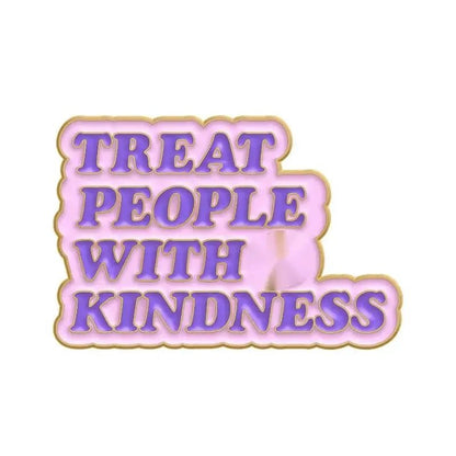 Pink and gold enamel pin with bold purple TREAT PEOPLE WITH KINDNESS text, shown on a white background—perfect to pair with your favorite red love heart enamel pin.