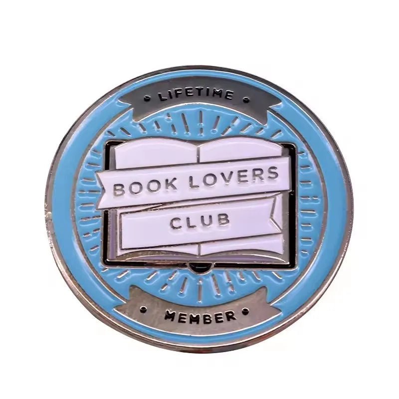 Add to your collection with this My Cutesy Era round blue and silver enamel pin. Featuring an open book with “BOOK LOVERS CLUB” and “LIFETIME MEMBER” around the edge, it’s perfect for every devoted reader.