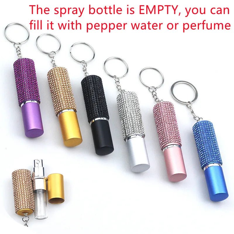 Six Gay Skate jeweled keychain spray bottles in assorted colors, one open to show the empty interior. Perfect for outdoor use—fill with pepper water or perfume. Text above: The spray bottle is EMPTY.