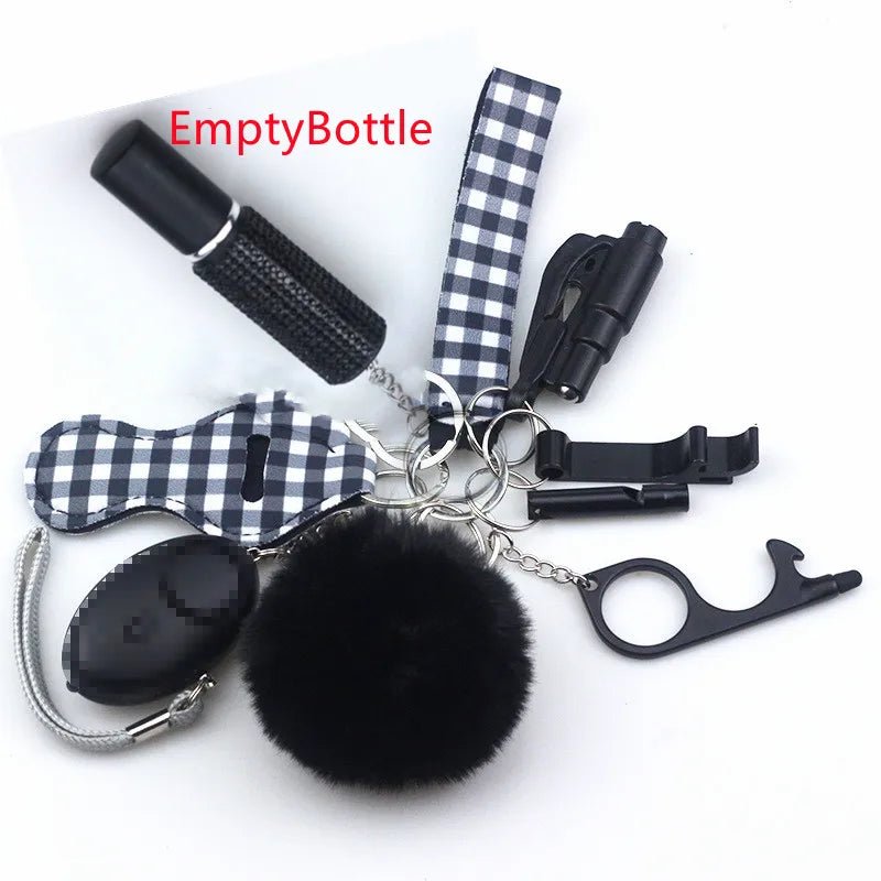 The Kiss Me Later keychain set features a black-and-white checkered strap and includes a small empty spray bottle, pom-pom, black oval object, whistle, whistle buckle, and black plastic touch tool—great for outdoor adventures.