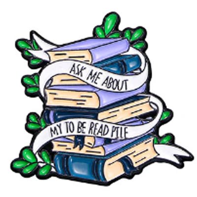A stack of blue and beige books with green leaves and a white ribbon that says, Ask me about my to be read pile. Perfect for Romance Reader enamel pin collectors and book lover badge fans