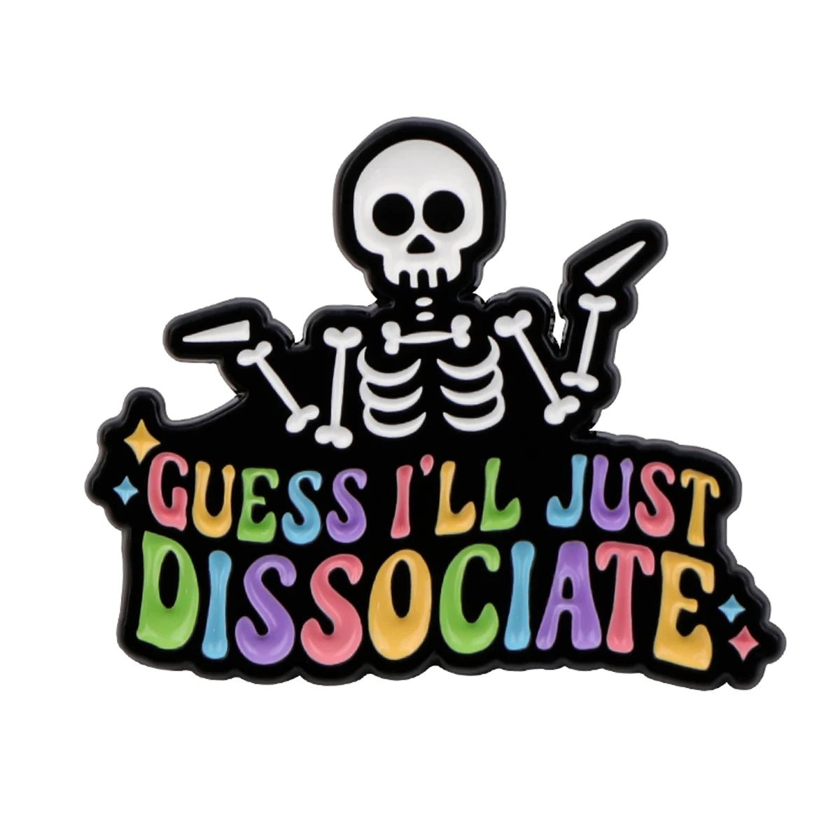 A quirky enamel pin by Kiss Me Later features a cartoon skeleton shrugging above GUESS ILL JUST DISSOCIATE in bold, colorful letters with sparkling stars—perfect for fans of spooky, playful accessories.