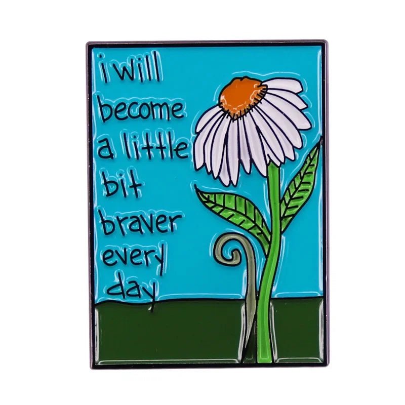 A drawing of a white daisy with a yellow center on a blue-green background. Text reads: I will become a little bit braver every day. Perfect floral enamel pin for fans by My Cutesy Era.
