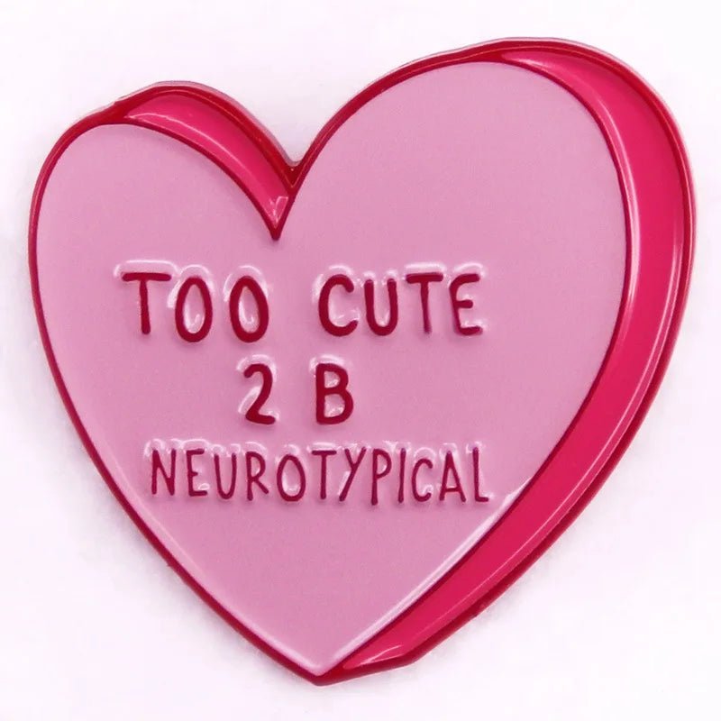 Show your playful side with My Cutesy Era’s pink and red heart-shaped enamel pin, featuring raised “TOO CUTE 2 B NEUROTYPICAL” text—perfect for those who love fun, quirky accessories.