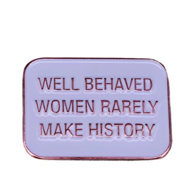 My Cutesy Eras rectangular enamel pin features a light purple background, red border, and the bold phrase WELL BEHAVED WOMEN RARELY MAKE HISTORY in red capitals—the perfect feminist statement accessory.
