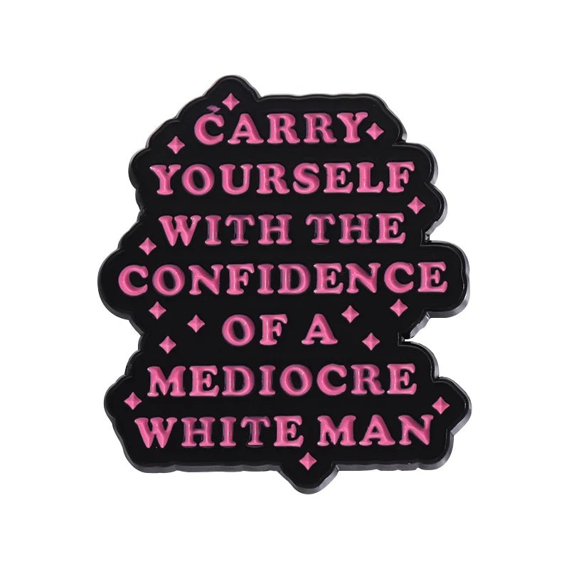 A black enamel pin by My Cutesy Era features pink text, Carry yourself with the confidence of a mediocre white man, and diamond accents—an ideal feminist gift or statement accessory for empowered women.