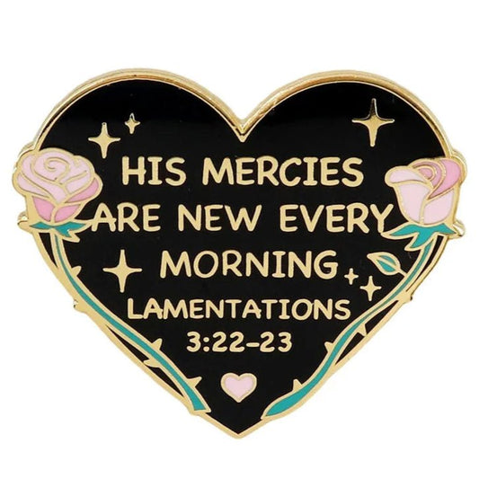 My Cutesy Era heart-shaped enamel pin features pink roses, gold accents, and the text: His Mercies Are New Every Morning. Lamentations 3:22-23 on a black background.