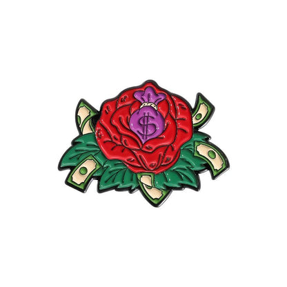 Enamel pin features a vibrant red rose with green leaves, a purple money bag with a dollar sign at the center, and dollar bills among the petals for a bold Red Rose Cash look.