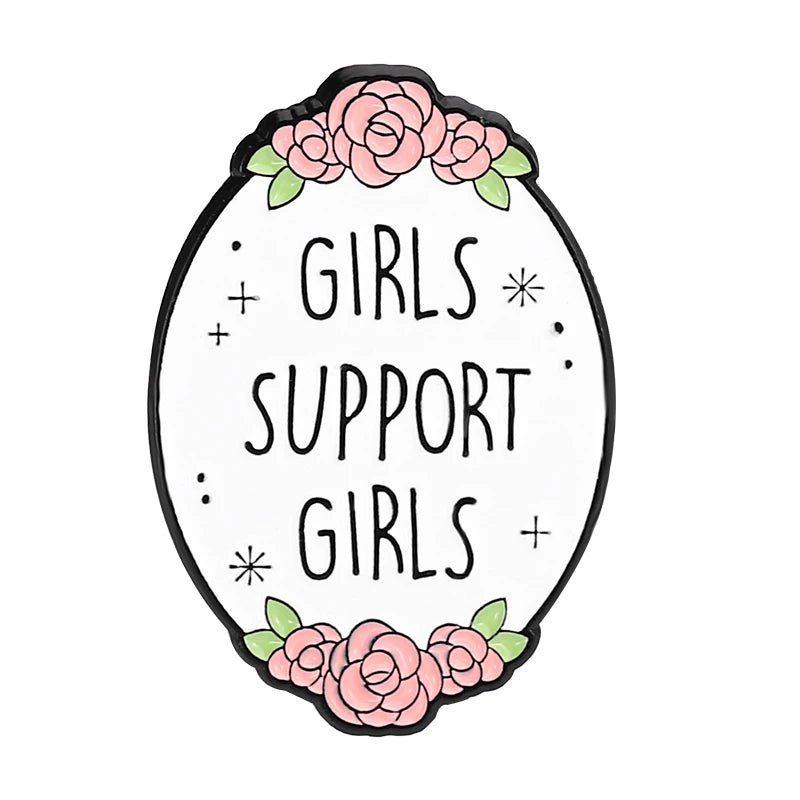 Enamel pin features an oval with pink flowers, green leaves, and “GIRLS SUPPORT GIRLS” in bold black on white—a perfect accessory for feminist pin fans.