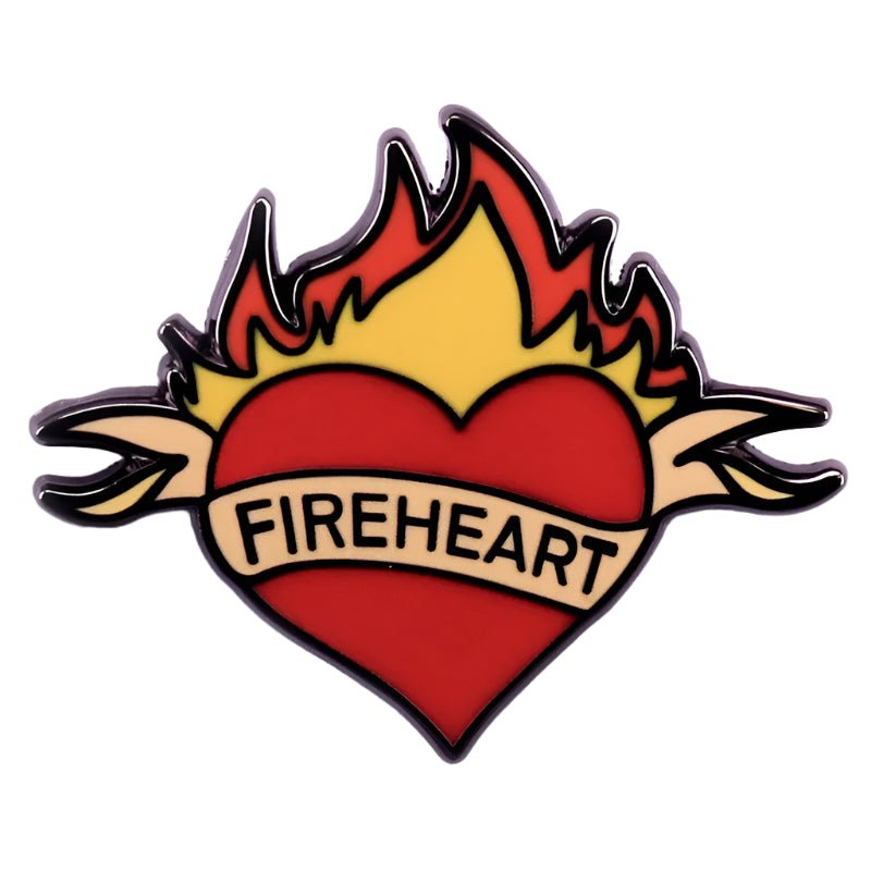 The My Cutesy Era pin features a red heart with yellow and orange flames, black outline, and a beige banner across the heart that reads “FIREHEART” in uppercase letters.