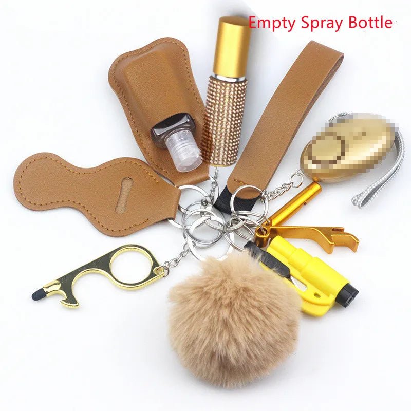 The Kiss Me Later keychain set includes tan and yellow personal safety accessories: pompom, LED flashlight, whistle, bottle opener, no-touch tool, pepper spray holder, and empty spray bottle—perfect for outdoor adventures.