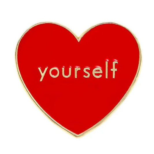Red heart-shaped pin with love 'yourself' text 